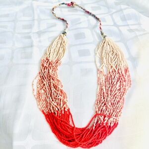 Orange Strands of Many Beads Necklace